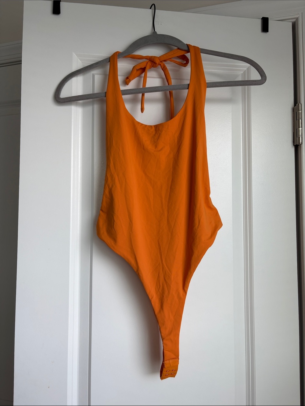 Edikted Orange Halter One-Piece Bodysuit